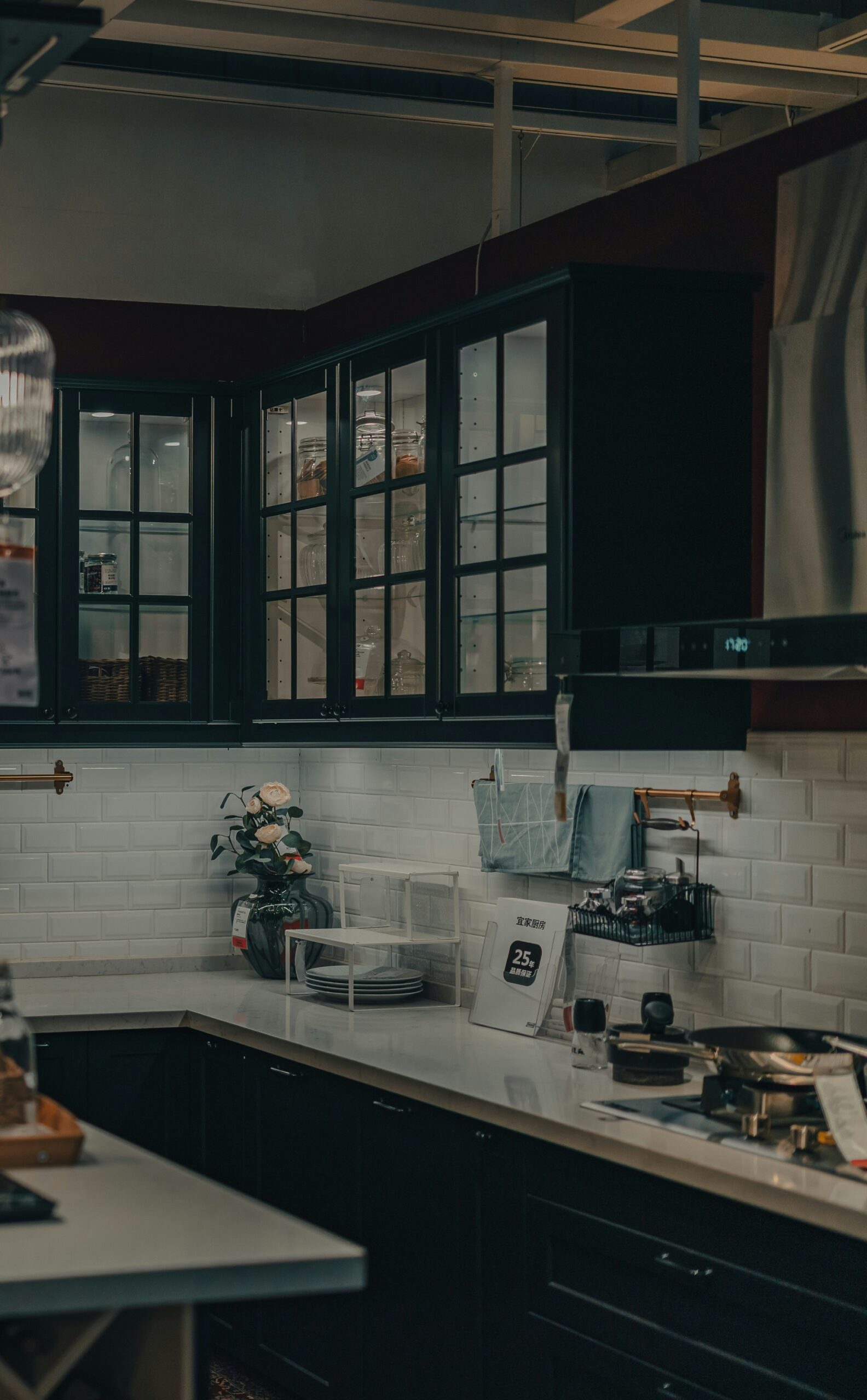 Black and white kitchen, with busy counters and cabinets