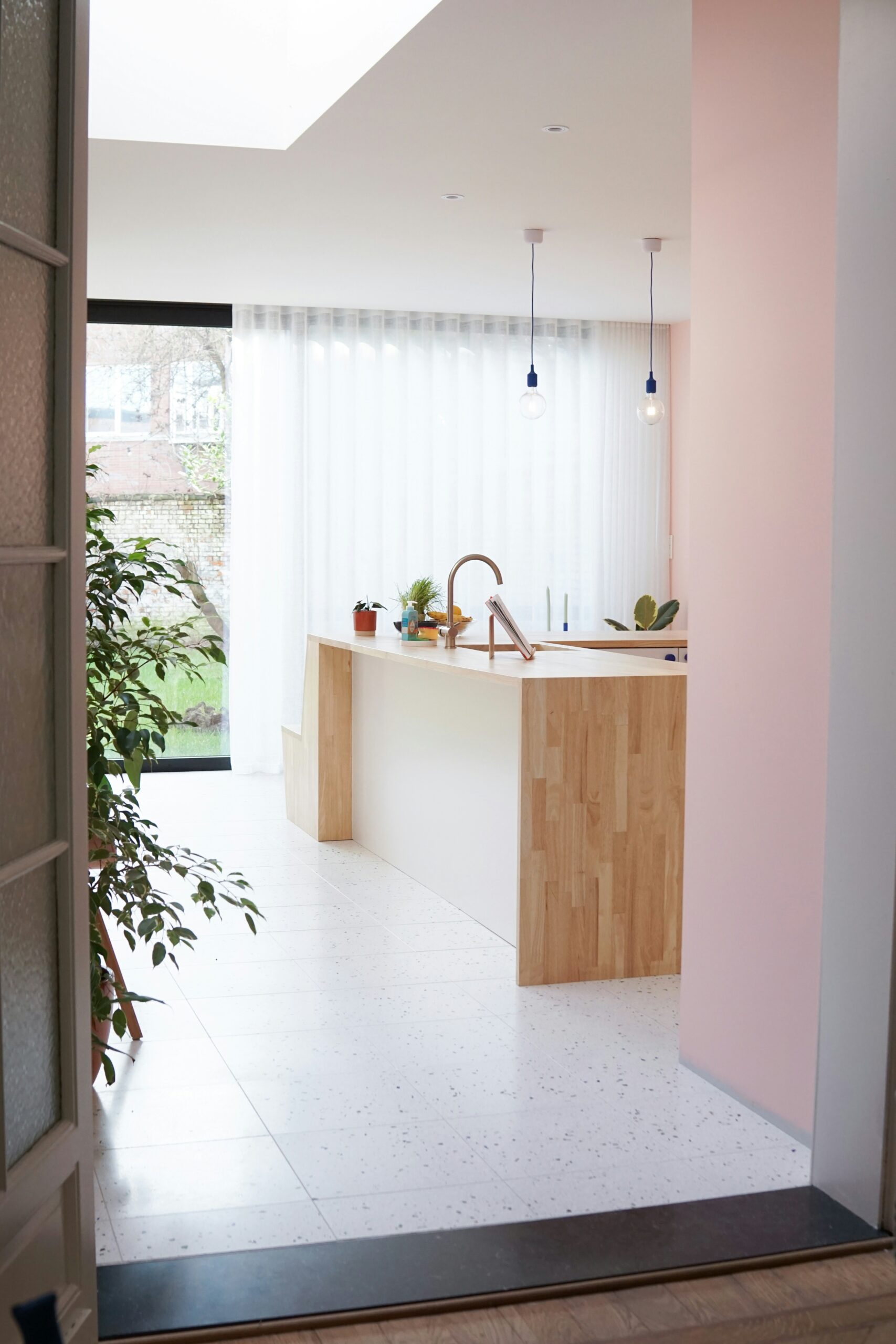 A kitchen with a sink and a window